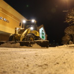 loader plowing in danbury shopping center