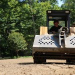 mustang loader on lawn in easton